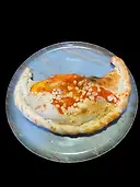 CALZONE CAPRICHOSA,  tomate, mozzarella, oregano, jamón, champiñon, alcachofa